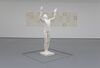 From Ruth Ewan's exhibition. A white statue of a naked person throwing their hands up in the air.