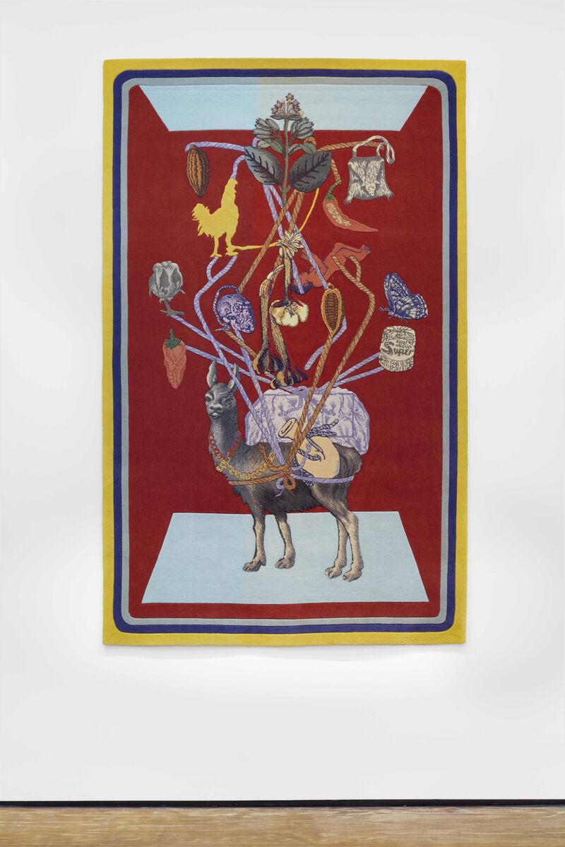 A tapestry shows an image of a camel, who is tied in ropes. From the ropes, we can see a chilli pepper, a skull, a butterfly and a rooster. The camel is standing against a red background.