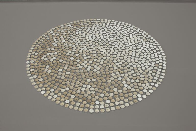 From Infinite Jest exhibition, a large circle on the floor is composed entirely of tea lights.