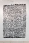 A large artwork delicately recreating a traditional rug in hand-drawn 3D filament