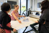 Zineb Sidera and Print Studio staff looking at a print