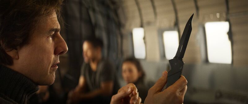 Tom Cruise holds a sharp knife.