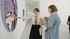 Pupil pointing at an arwork in DCA galleries while talking to teacher