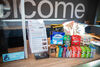 DCA's Box Office counter, which has cinema listings on it and a small display of snacks that cinema-goers can buy.