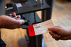 Close up of DCA staff member scanning a persons ticket