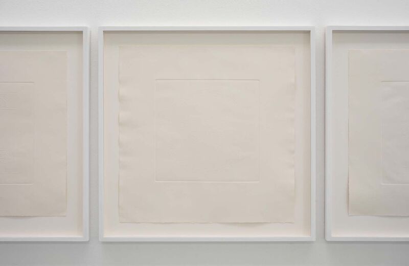An embossed image in a white frame, the blind embossing only just visible